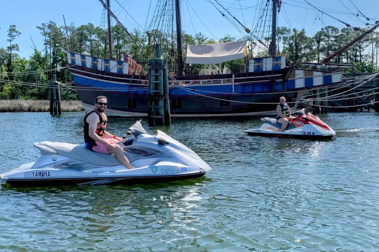 Jet ski tour passing a shrimp boat landmark near Wanchese