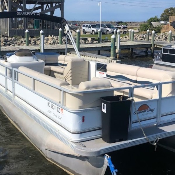 Causeway watersports pontoon boat rental sitting at the dock.
