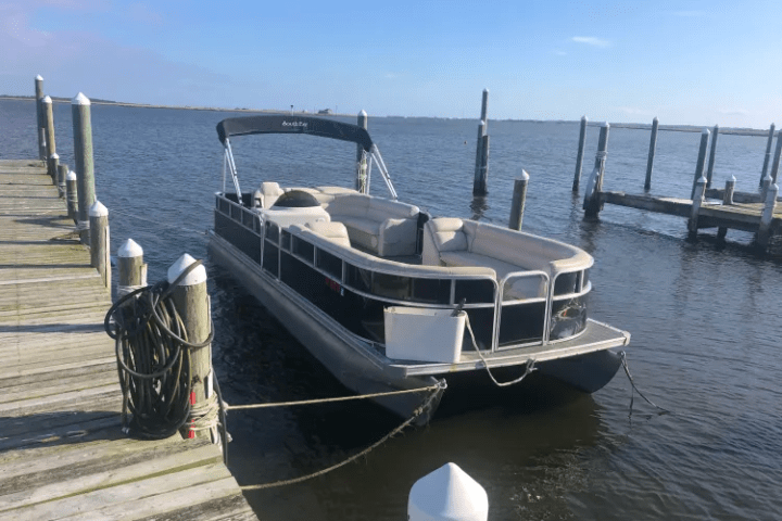 Causeway Watersports 16 person pontoon sitting at the dock in between rentals.