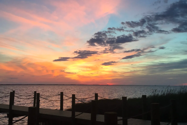 a sunset over a body of water