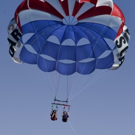 Two people parasailing in nags head, with Causeway Watersports