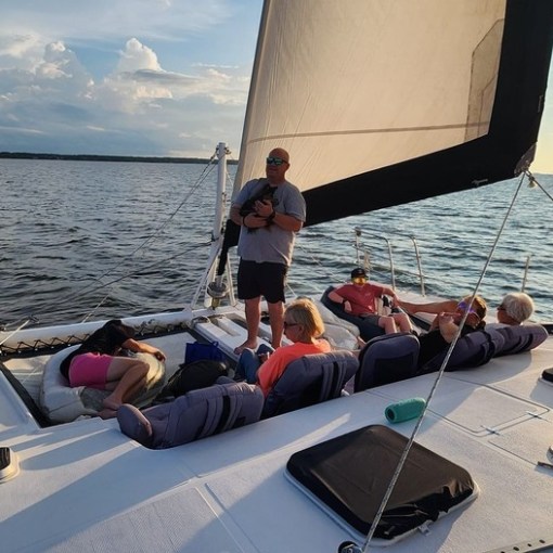 A family enjoying a day sailing on the Outer Banks.