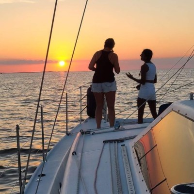 A couple enjoying a amazing OBX sunset cruise with Causeway Watersports.