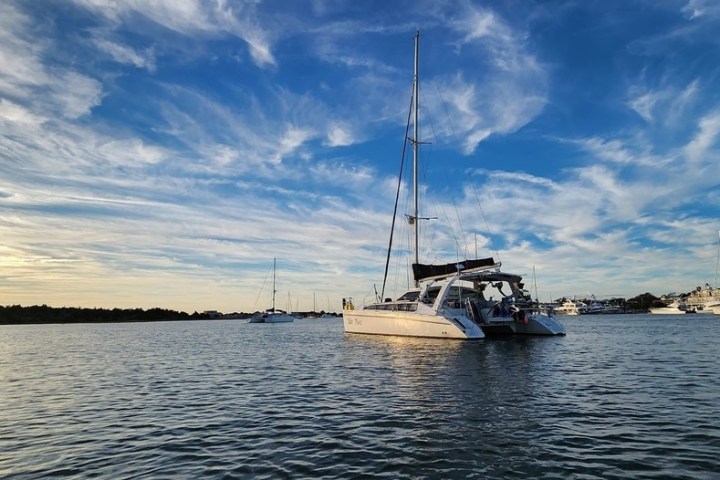 A beautiful sailing catamaran cruising the waters of Nags head on a private charter.