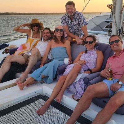a family posing on their Outer Banks sunset cruise with Causeway Watersports